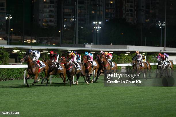 Jockeys compete the Race 3 Busan Handicap at Happy Valley Racecourse on April 25, 2018 in Hong Kong, Hong Kong.