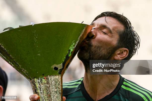 Juventus goalkeeper Gianluigi Buffon kisses the Serie A soccer title trophy after the Serie A football match n.38 JUVENTUS - VERONA on at the Allianz...