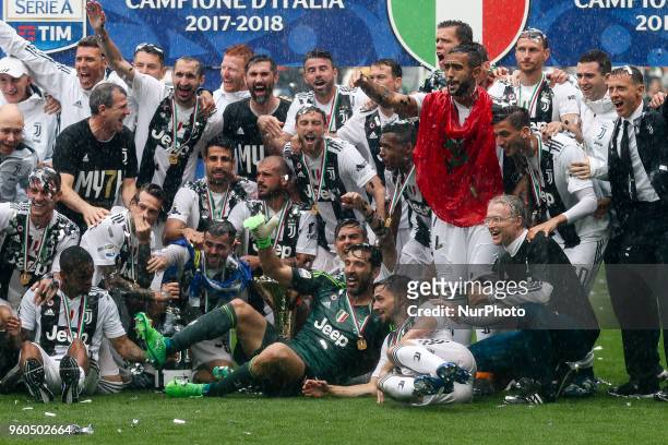 Juventus team celebrates during the prize giving ceremony holding the Serie A soccer title trophy after the Serie A football match n.38 JUVENTUS -...