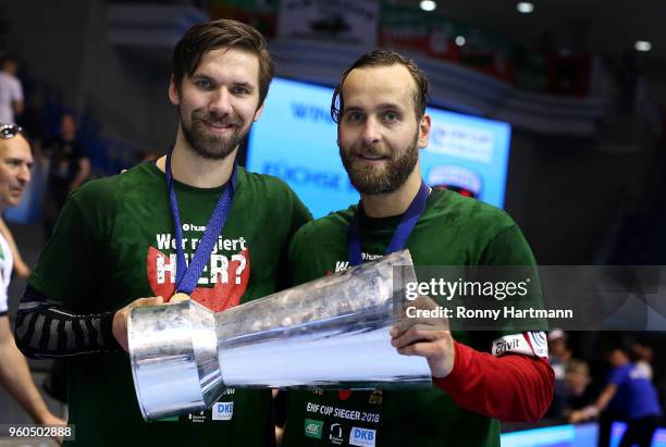 Fabian Wiede and goalkeeper Silvio Heinevetter of Fuechse Berlin pose with the trophy after winning the Ottostadt Magdeburg EHF Cup Final Four 2018...