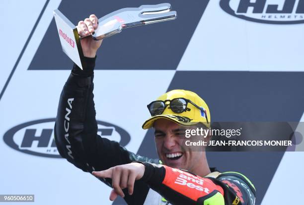 Third placed KTM Bester Capital Dubai Spanish rider Marcos Ramirez celebrates on the podium after the Moto3 race of the French Motorcycle Grand Prix...