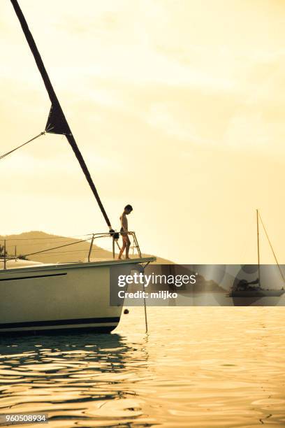 family having a fun on their vacations on sailboat - miljko stock pictures, royalty-free photos & images