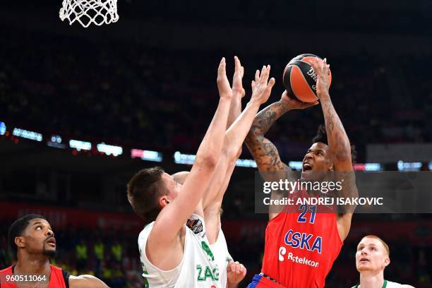 Zalgiris' Lithuanian forward Edgaras Ulanovas fights for the ball against CSKA's US forward Will Clyburn during the Euroleague Final Four third-place...