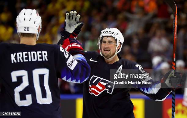Chris Kreider of the United States celebrate with team mate Dylan Larkin after he scores the 4th goal during the 2018 IIHF Ice Hockey World...