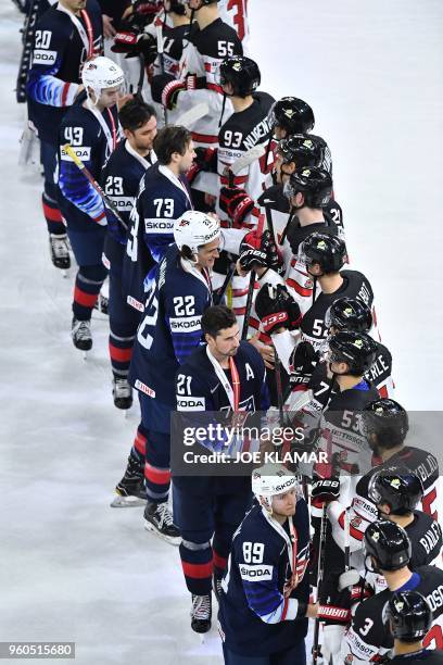 Players shake hands after the bronze medal match USA vs Canada of the 2018 IIHF Ice Hockey World Championship at the Royal Arena in Copenhagen,...