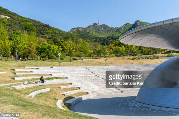 an outdoor concert hall with the mountain at background - sungjin kim stock pictures, royalty-free photos & images