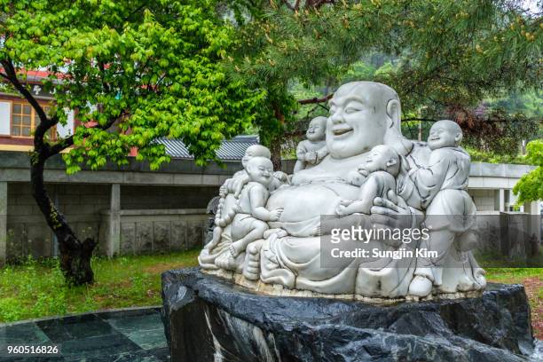 statue of dharma at the buddhist temple - sungjin kim stock pictures, royalty-free photos & images