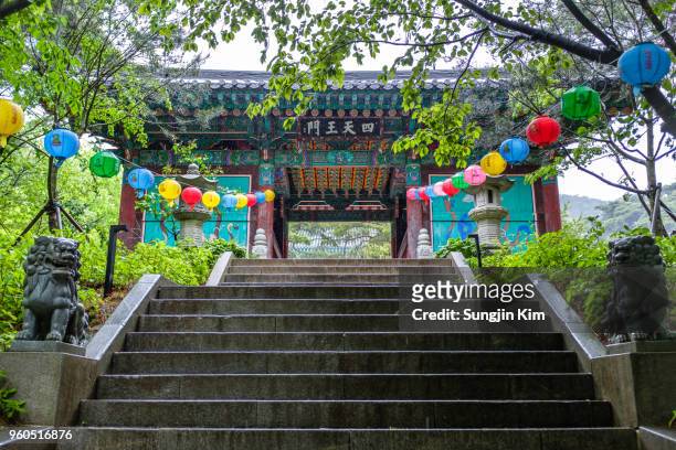 stairway to the gate of the temple on rainy day - sungjin kim stock pictures, royalty-free photos & images