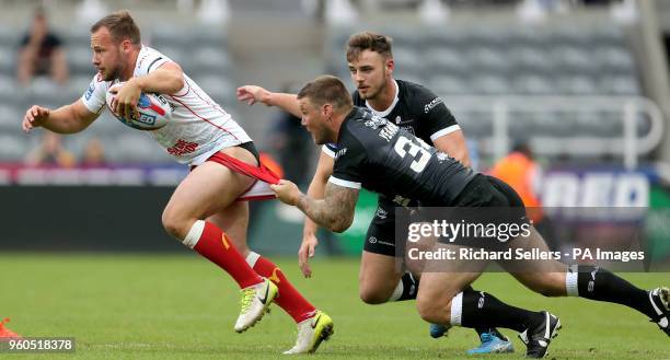 Hull FC's Kirk Yeaman grabs Hull KR's Adam Quinlan shorts during the Betfred Super League, Magic Weekend match at St James' Park, Newcastle.