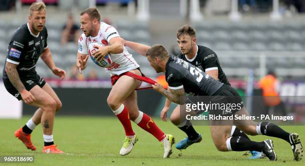 Hull FC's Kirk Yeaman grabs Hull KR's Adam Quinlan shorts during the Betfred Super League, Magic Weekend match at St James' Park, Newcastle.
