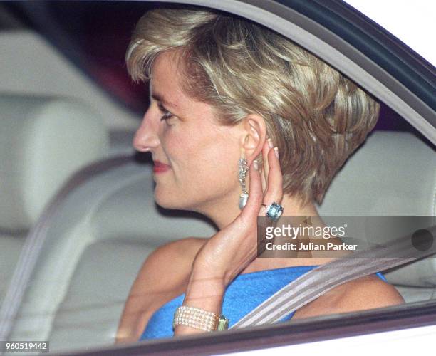 Retransmission of with alternate crop.) Diana, Princess Of Wales wears an emerald-cut aquamarine ring as she attends The Victor Chang Research...