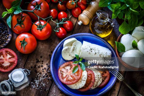 homemade healthy caprese salad - caprese salad overhead stock pictures, royalty-free photos & images