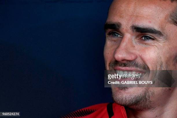 Atletico Madrid's French forward Antoine Griezmann smiles on the bench during the Spanish league football match between Club Atletico de Madrid and...