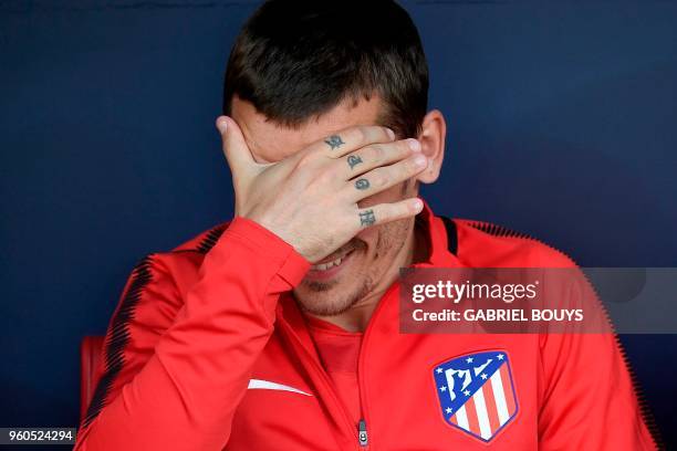 Atletico Madrid's French forward Antoine Griezmann gestures on the bench during the Spanish league football match between Club Atletico de Madrid and...