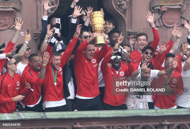 Frankfurt's players celebrate their team's victory in the German Cup DFB Pokal final on the balcony of city hall at the Roemerberg square in...