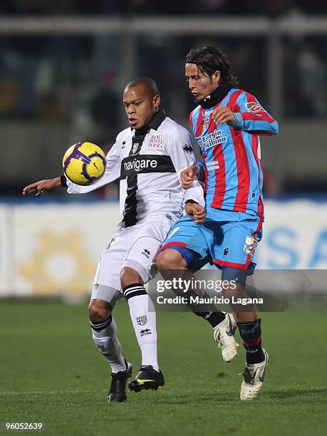 Marco Biagianti of Catania Calcio competes for the ball with Jonathan Biabiany of Parma FC during the Serie A match between Catania and Parma at...
