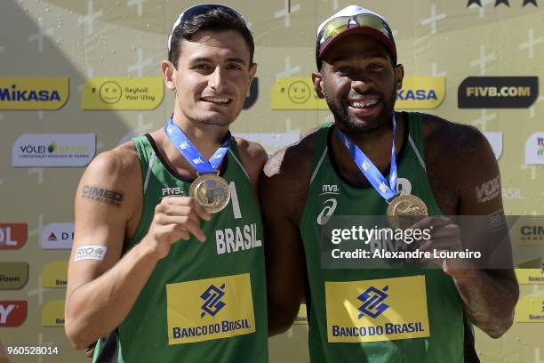 Gold medalist Evandro Goncalves and Andre Loyola Stein of Brazil celebrates the victory during the medal ceremony after the Menâs FInal match at Meia...