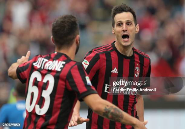 Nikola Kalinic of AC Milan celebrates his goal with his team-mate Patrick Cutrone during the serie A match between AC Milan and ACF Fiorentina at...