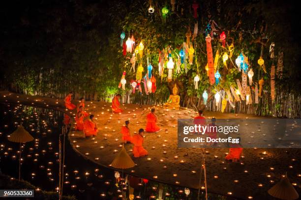 candle light up festival in special buddhist religious holiday and new year festival at pantoa temple , chiangmai, thailand - asalha puja bildbanksfoton och bilder