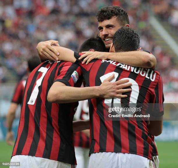 Nikola Kalinic of AC Milan celebrates his goal with his team-mates Patrick Cutrone and Hakan Calhanoglu during the Serie A match between AC Milan and...
