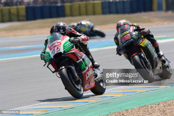 Scott Redding of Great Britain and Aprilia Racing Team Gresini leads Hafizh Syahrin of Malaysia and Monster Yamaha Tech 3 during the MotoGP race...