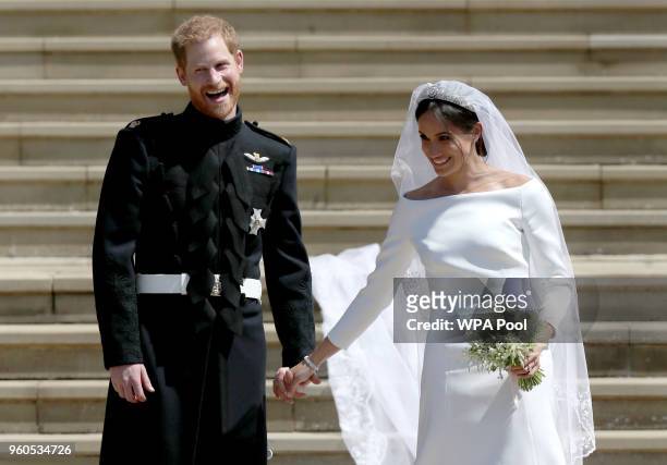 Prince Harry, Duke of Sussex and the Duchess of Sussex depart after their wedding ceremonyat St George's Chapel at Windsor Castle on May 19, 2018 in...