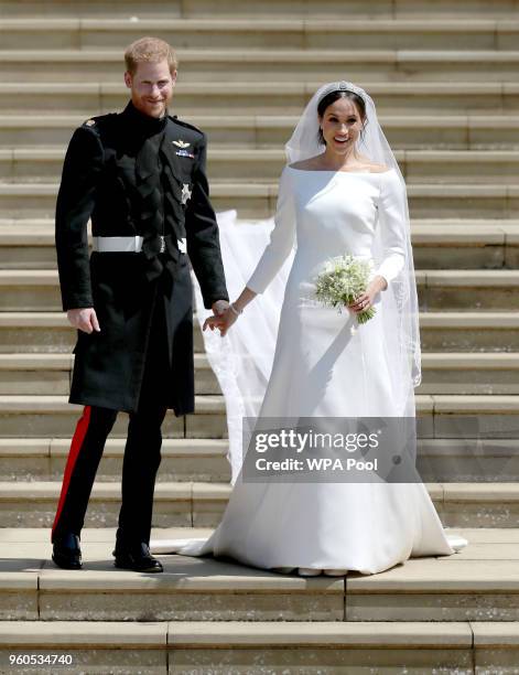 Prince Harry, Duke of Sussex and the Duchess of Sussex depart after their wedding ceremonyat St George's Chapel at Windsor Castle on May 19, 2018 in...