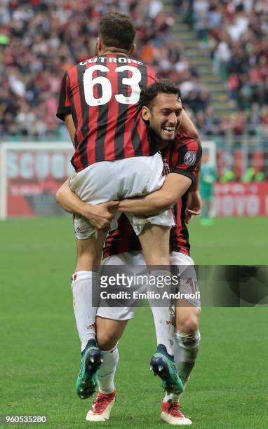Patrick Cutrone of AC Milan celebrates his second goal with his team-mate Hakan Calhanoglu during the Serie A match between AC Milan and ACF...