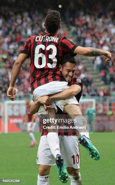 Patrick Cutrone of AC Milan celebrates his second goal with his team-mate Hakan Calhanoglu during the Serie A match between AC Milan and ACF...