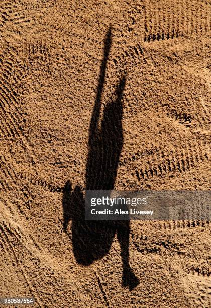 An athletes shadow is cast across the sand pit during the Women's Long Jump event at the Loughborough International Athletics event on May 20, 2018...