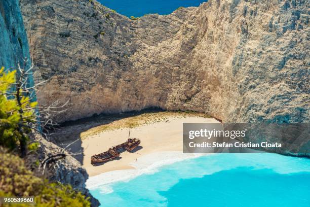 unique navagio beach zakynthos, greece, europe - shipwreck stock pictures, royalty-free photos & images