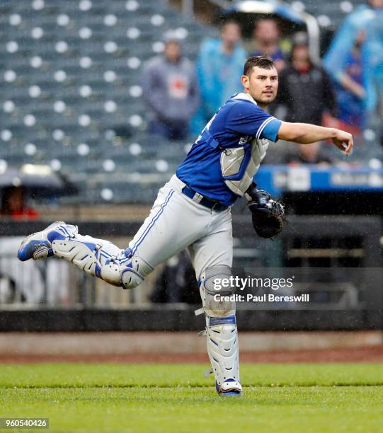 Catcher Luke Maile of the Toronto Blue Jays throws to first base during a interleague MLB baseball game against the New York Mets on May 16, 2018 at...