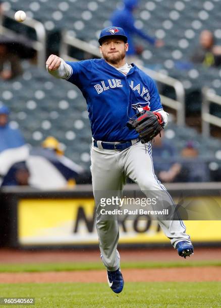 Josh Donaldson of the Toronto Blue Jays fields a ground ball and throws to first base in an interleague MLB baseball game against the New York Mets...
