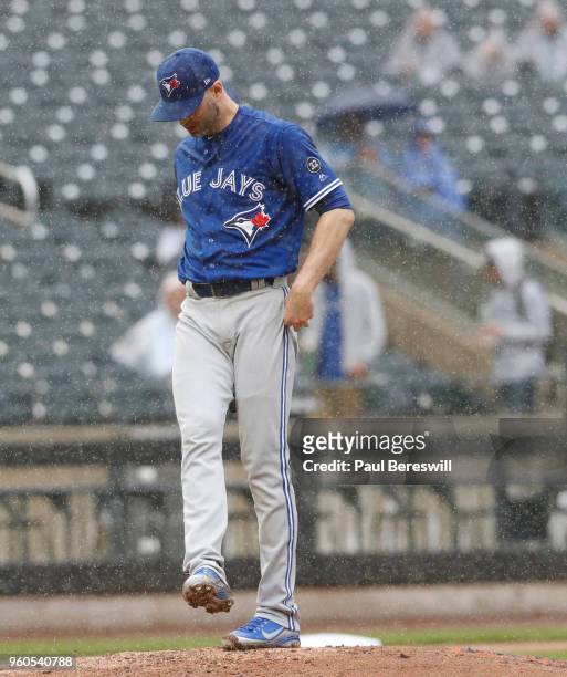 Pitcher J.A. Happ of the Toronto Blue Jays kicks at the mound during a interleague MLB baseball game against the New York Mets on May 16, 2018 at...