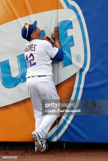 Juan Lagares of the New York Mets catches a fly ball hit by Giovanny Urshela in the ninth inning in an interleague MLB baseball game against the...