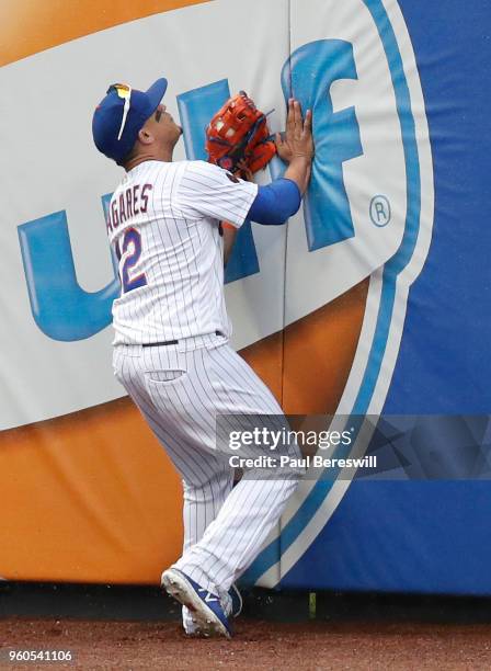 Juan Lagares of the New York Mets catches a fly ball hit by Giovanny Urshela in the ninth inning in an interleague MLB baseball game against the...