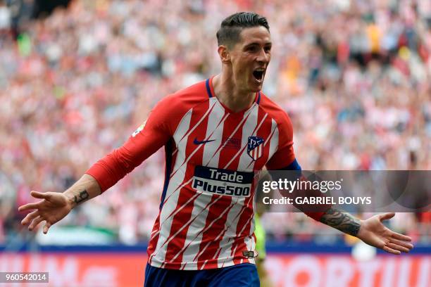 Atletico Madrid's Spanish forward Fernando Torres celebrates after scoring a goal during the Spanish league football match between Club Atletico de...