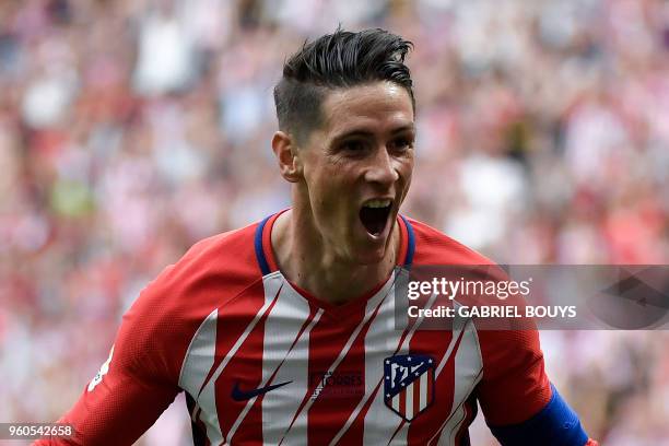 Atletico Madrid's Spanish forward Fernando Torres celebrates after scoring a goal during the Spanish league football match between Club Atletico de...