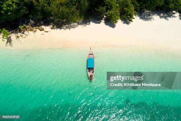 long tail boat on the beach.wonderful background.aerial view from andaman beach. - phuket stock-fotos und bilder