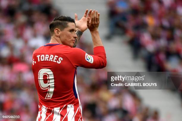 Atletico Madrid's Spanish forward Fernando Torres claps during the Spanish league football match between Club Atletico de Madrid and SD Eibar at the...
