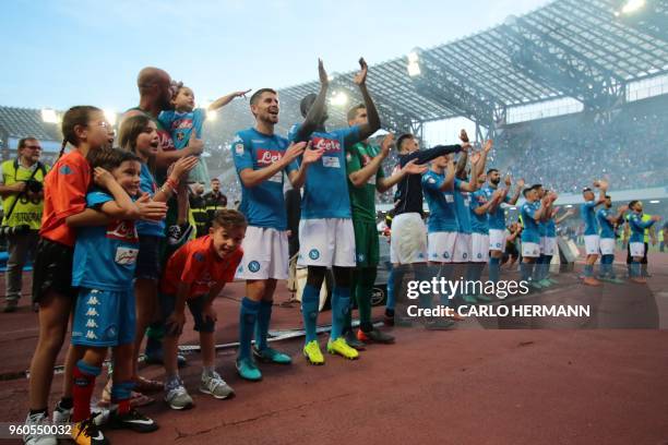 Napoli's players greet fans at the end of the Italian Serie A football match SSC Napoli vs FC Crotone on May 20, 2018 at the San Paolo Stadium.