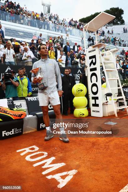 Rafael Nadal of Spain celebrates with the trophy after victory in his Mens Final match against Alexander Zverev of Germany during day 8 of the...