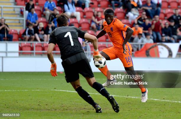 Quinten Maduro of the Netherlands scores his sides second goal past Alessandro Russo of Italy during the UEFA European Under-17 Championship Final...