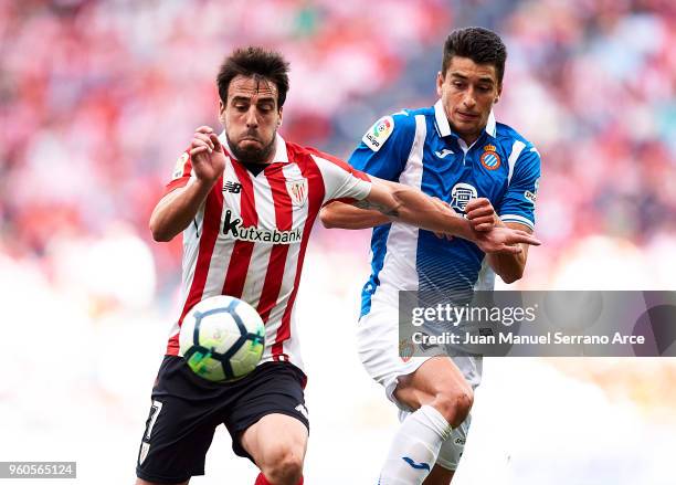 Benat Etxebarria of Athletic Club competes for the ball with Marc Roca of RCD Espanyol during the La Liga match between Athletic Club and RCD...