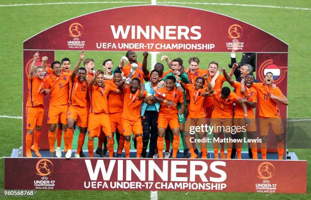 The Netherlands team celebrate victory with the trophy after the UEFA European Under-17 Championship Final between Italy and the Netherlands at New...