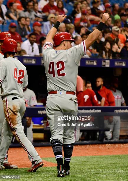 Rhys Hoskins of the Philadelphia Phillies celebrates after scoring a run against the Tampa Bay Rays in the third inning on April 15, 2018 at...