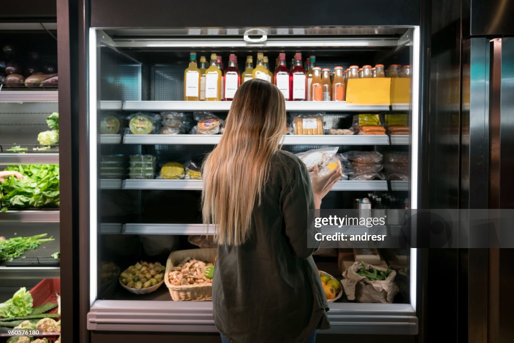 Woman buying food at the supermarket