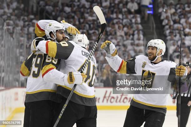 Alex Tuch of the Vegas Golden Knights celebrates with teammates after scoring a goal during the first period against the Winnipeg Jets in Game Five...