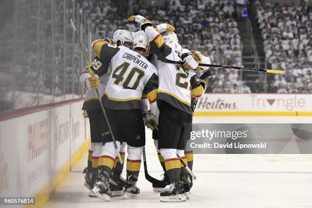 Alex Tuch of the Vegas Golden Knights celebrates with teammates after scoring a goal during the first period against the Winnipeg Jets in Game Five...