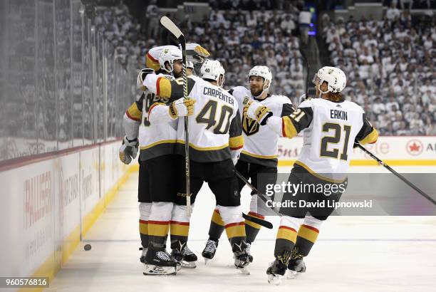 Alex Tuch of the Vegas Golden Knights celebrates with teammates after scoring a goal during the first period against the Winnipeg Jets in Game Five...